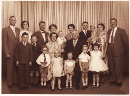 Family photograph of Bert Platt with his wife, children and grandchildren. Not all soldiers' stories ended unhappily. Bert Platt returned to the Parkes Shire and became a husband, father and grandfather. Here he is in a family photograph. Grandson Bob Gould is the young boy furthest to the left in the suit.
