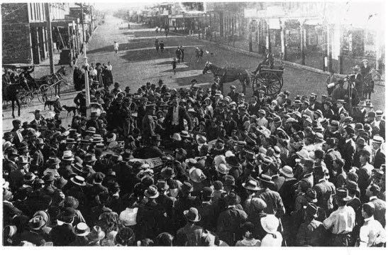 A reception in the Square to welcome returning solider, Roy Stewart in 1915. Clarinda Street continues into the background while Welcome Street can just be seen (where a horse and buggy are in top left of photograph) Source: Parkes: A Photographic History by Ian Chambers, 1988 Self-published: Parkes, NSW page 125