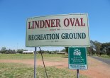 Photograph of signage at Lindner Oval, Peak Hill. Photograph by Sandie Ward (Parkes Shire Library) taken on February 10th, 2016. In the background are the changing sheds and canteen amenities buildings.