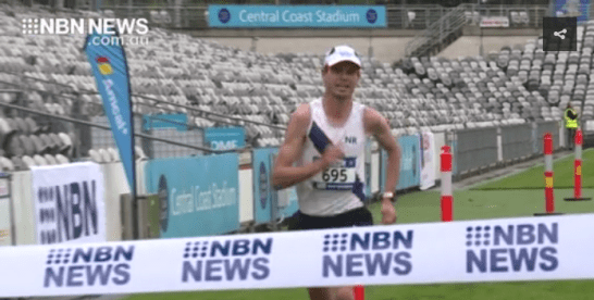 Still photograph of video footage highlighting Scott Westcott's win in the half marathon event at the Bay To Bay Running Festival. Source: NBN News website