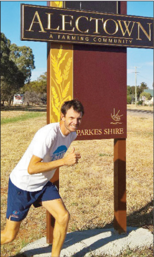 The "Alectown Ace" posing next to his home town's sign. [Digital image]. (2016, April 28). Retrieved July 08, 2016, from http://www.parkeschampionpost.com.au/story/3875674/scott-poised-for-dream-run/