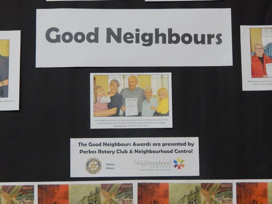 Photograph of the rear side of Parkes Library's History Week display. The theme this year is Neighbours. Photographs from Parkes Champion Post's feature of Good Neighbours Awards 2016. Photograph by Dan Fredericks (Parkes Shire Library) taken September 2, 2016