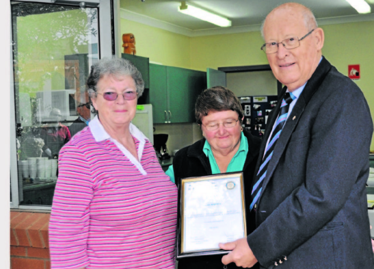 Nominator, Pat Bailey (left) with her Good Neighbour Cae Angrave (centre) and Rotary president, Peter Woods (right). Source: Parkes Champion Post 7 June 2013