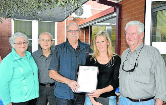 Winner of the 2014 Parkes Good Neighbours Award, Margaret Jones (centre) receives her prize from Rotarian, David Hughes. The neighbours who nominated her are also pictured: Jeanette and Mick Holland (left) and Terry Hetherington (right) Source: Parkes Champion Post 18 May 2014