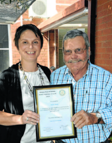 Indigo Kriedmann, representing nominators the Kriedmann family, with Good Neighbour nominee Roger Hood. Source: Parkes Champion Post 18 May 2014