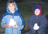 Cropped photograph of the front page of Parkes Champion Post featuring visiting Max (11) and Casey (9) who were travelling with their parents to Noosa and stopped over in Parkes the very day that it snowed! Source: Parkes Champion Post Friday June 24, 2005 page 1