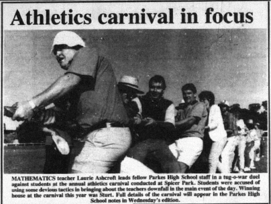 A regular feature during the month of May are the many school athletics carnivals. This photograph, featuring former mathematics teacher and current volunteer of many services Laurie Ashcroft, leading the staff in a tug-o-war duel against students. The winning house in 1990 was Sturt. Source: Parkes Champion Post Monday, May 21, 1990 page 18