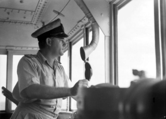Lieutenant Commander N.O. (Paddy) Vidgen RAN, captain of HMAS Parkes on the bridge. Source: Royal Australian Navy website