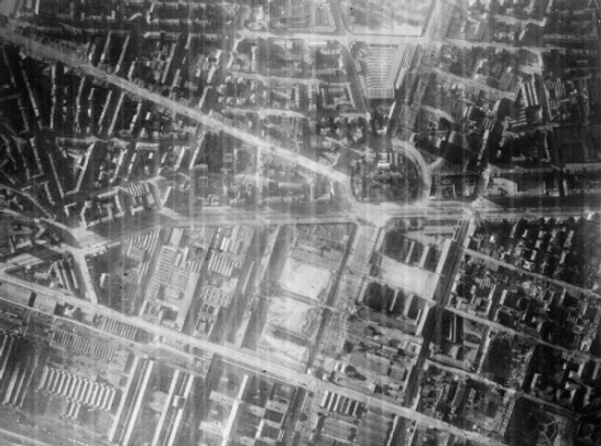 Vertical night aerial photograph taken over Turin with the aid of a 4.5 inch Photoflash bomb, during a raid by aircraft of Bomber Command. The area illuminated is around the Piazza Adriano (right of centre), crossed by Corso Francesco Ferrucci and Corso Vittorio Emanuele II. Source: World War II Today website