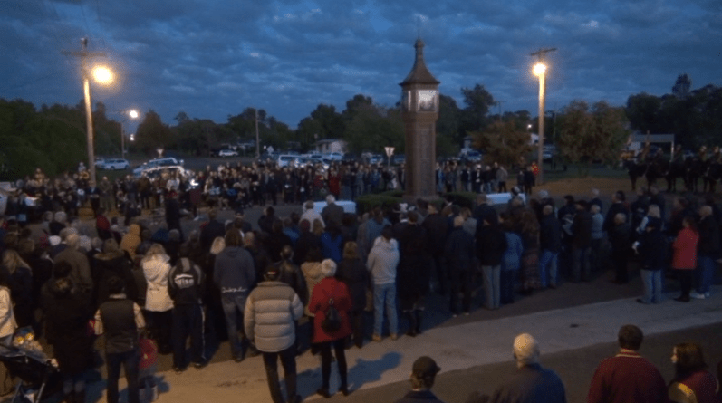 A large turnout for the centenary of ANZAC Day service at Bogan Gate. This is a still image of video available as a reference item in Parkes Shire Library titled ANZAC 100 Years: Gallipoli 100th Anniversary ANZAC Day 2015 Bogan Gate & Trundle.