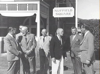 Group of men including Lord Nuffield and Premier James McGirr at Nuffield Square, Sydney factory of British Motor Corporation, Zetland. The address is between Joynton Avenue and South Dowling Street, Zetland. Nuffield Square was on the site of Old Victoria Park Racecourse and was purchased by Lord Nuffield for an assembly plant for Morris Minor and Oxford cars in 1950. Source: City of Sydney Archives